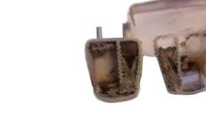 Chambre de compression bouchée